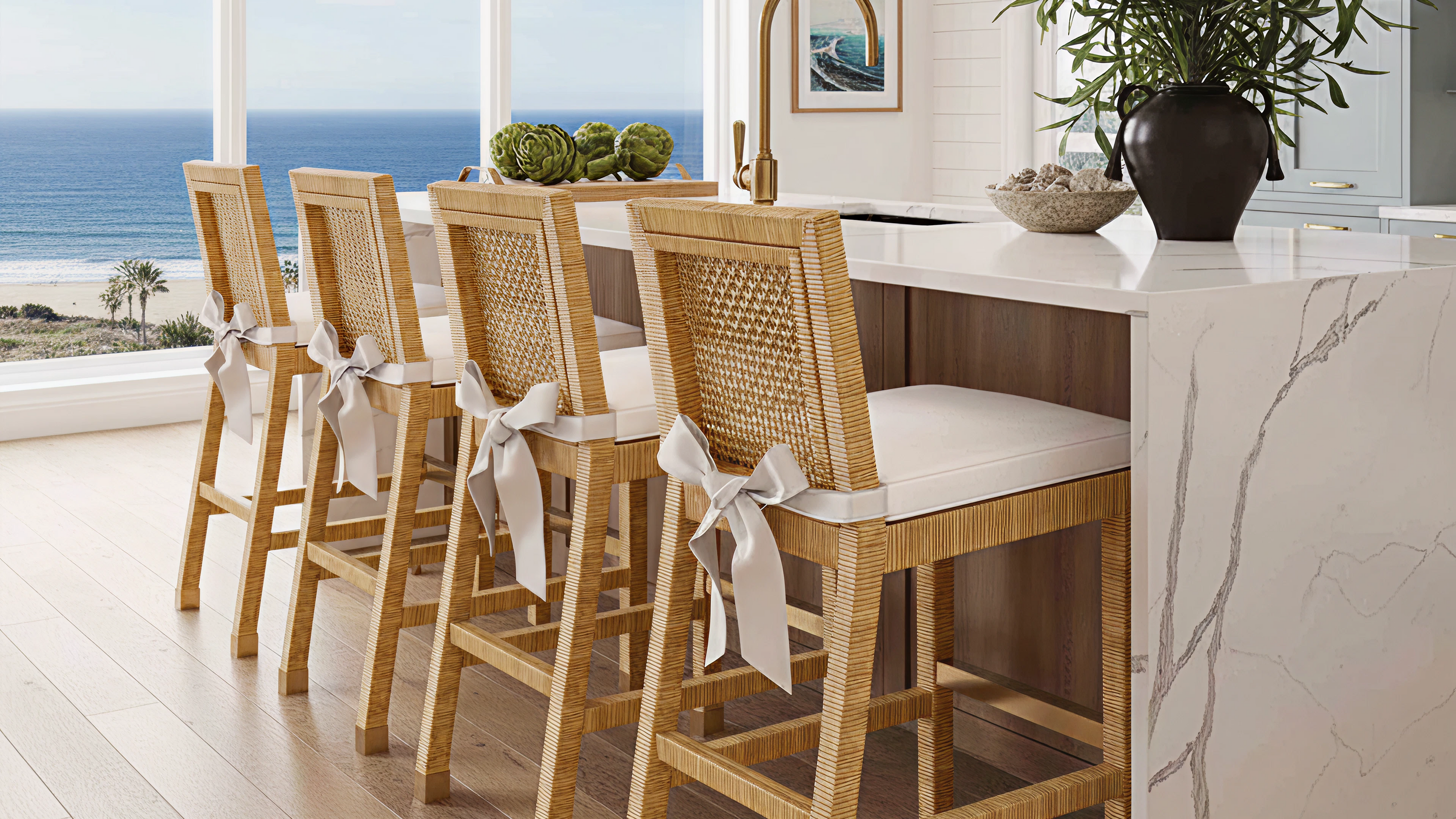 Wooden bar stools with white cushions in a modern kitchen with ocean view
