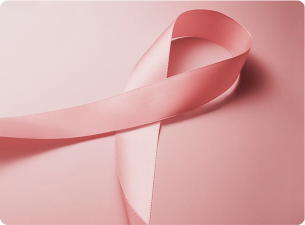 Close-up of a pink ribbon on a pink background