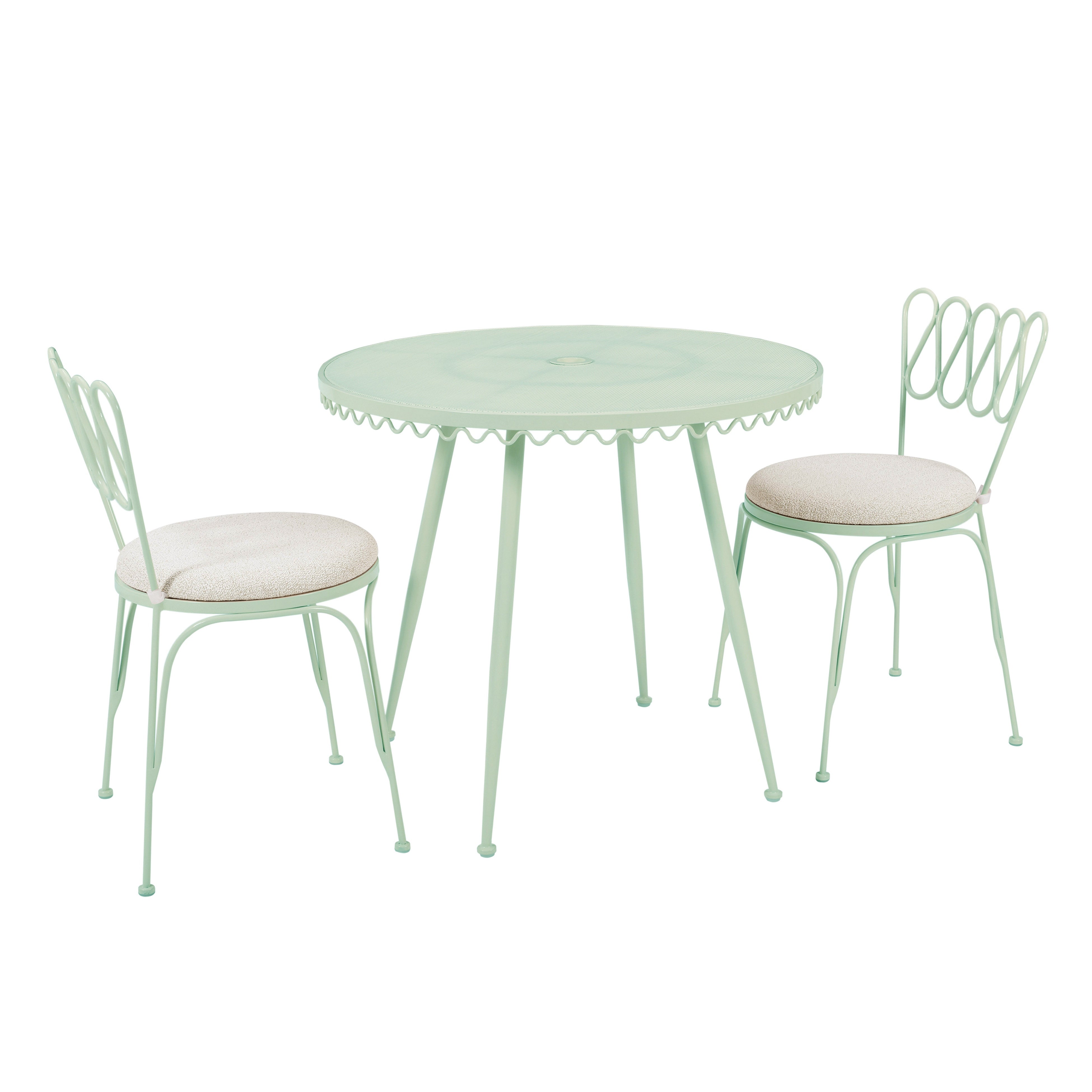 green wrought iron table and chairs